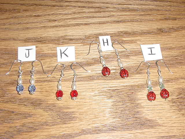 All earrings are made with czech ladybug beads or with ruby red or blue czech beads, sterling silver beads and spacers and wires.