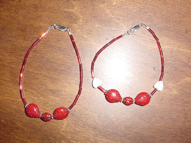 Family, heart and red thread bead ladybug sterling silver bracelets.