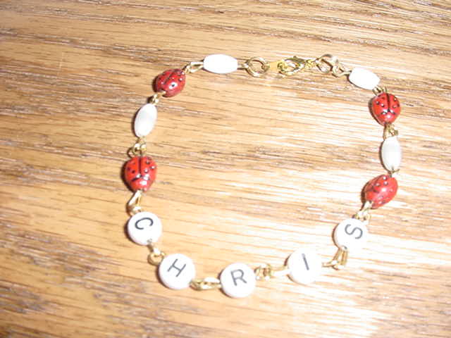 Ladybug name bracelet in sterling silver findings.  
